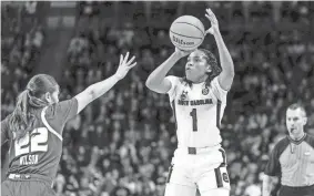  ?? JEFF BLAKE/USA TODAY SPORTS ?? South Carolina guard Zia Cooke (1) shoots over South Florida guard Aerial Wilson (22) in the first half at Colonial Life Arena.