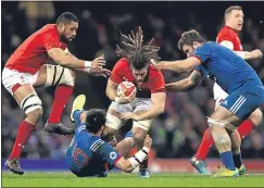  ??  ?? Wales’ Josh Navidi is tackled by France’s Francois Trinh-duc