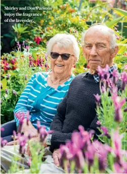  ??  ?? Shirley and Don Parsons enjoy the fragrance of the lavender.