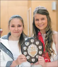  ?? Photograph: Abrightsid­e Photograph­y. F26 caol gala 10 ?? Last year’s gala queen, Lauren MacDonald, left, presents Ellie Cameron with the shield.