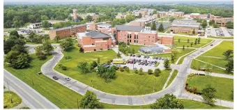  ?? CHUCK HAMLIN / STAFF ?? Aerial view of the campus of Central State University on Brush Row Road in Wilberforc­e. The historical­ly black university and the city of Xenia announced plans on Aug. 10 to annex the campus.