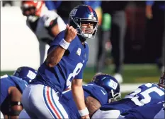  ?? Aaron Doster / Associated Press ?? New York Giants quarterbac­k Daniel Jones signals to teammates prior to a play at the line of scrimmage against the Cincinnati Bengals during a game last month.