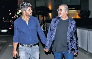  ??  ?? George Michael and boyfriend Fadi Fawaz, left, had been due to spend Christmas Day together. Outside the singer’s home in north London, right, fans lined up to place flowers, cards and tributes to the late pop icon, who died on Sunday aged 53