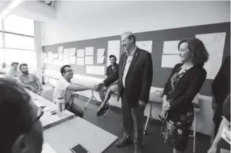  ?? John Leyba, The Denver Post ?? Former Mexican President Vicente Fox shakes the hand of a student in the Aerospace and Engineerin­g Sciences Building at Metropolit­an State University of Denver. Fox was touring the university Wednesday.