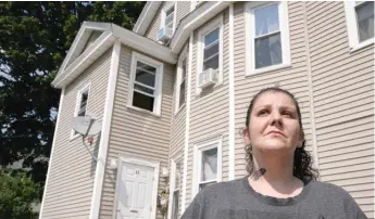  ?? STEVEN SENNE/AP ?? Roxanne Schaefer, of West Warwick, R.I., stands outside of her apartment building on Tuesday.