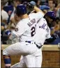  ?? JULIA NIKHINSON – AP ?? The Mets’ Pete Alonso, left, and Starling Marte celebrate Alonso’s go-ahead homer.