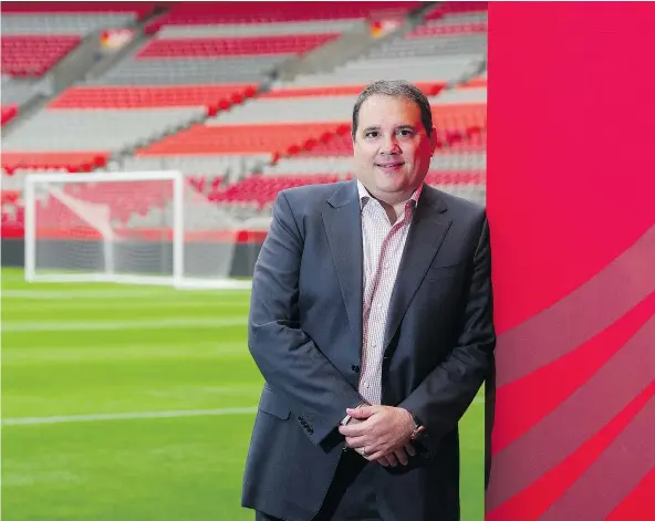  ?? GERRY KAHRMANN/PNG FILES ?? Canada Soccer president Victor Montaglian­i relaxes on the pitch at B.C. Place Stadium, where the turf would be replaced by a natural grass field in time for the 2026 World Cup if the joint host bid from Canada, the United States and Mexico is successful.