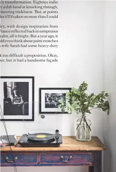  ??  ?? living room A vintage sideboard now rocks to a fresh beat.
Get the look Find a similar sideboard at Original House. The Mick Jagger and Johnny Cash photograph­s are from the Michael Ochs Archive at Getty Images.