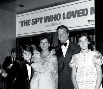  ??  ?? FROM ABOVE: Roger with his wife, Luisa, and two of their children, Geoffrey and Deborah, at the premiere of The Spy Who Loved Me in 1977; Deborah and her dad in 1998; the pair in Italy in 1986; outside Langan’s Brasserie, a favourite eatery of the rich...