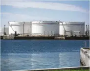  ?? Mark Mulligan / Staff file photo ?? Oil storage tanks, like these at the Port of Corpus Christi, are nearing capacity as the glut worsens.