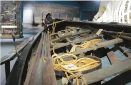  ??  ?? Bottom: Original whaleboat displayed next to a sperm whale skeleton to show scale.