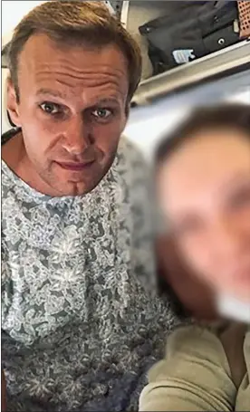  ??  ?? AIRPORT POSE: Alexei Navalny with a fan before his dramatic in-flight collapse