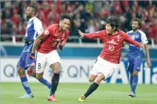 ?? — AFP ?? Urawa Red Diamonds’ Rafael Da Silva (2nd L) celebrates scoring with Yosuke Kashiwagi (2nd R) during the second leg of the AFC Champions League final against Saudi Arabia’s Al Hilal in Saitama