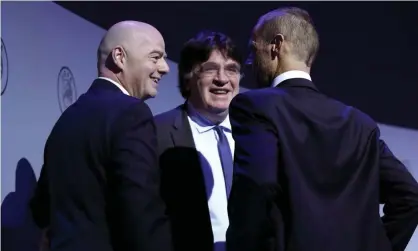  ??  ?? The Fifa president, Gianni Infantino, with Uefa’s general secretary, Theodore Theodorid, and president, Aleksander Ceferin at this month’s Uefa congress. Photograph: Alexander Hassenstei­n/Uefa via Getty Images