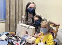  ??  ?? Aimee, Fortunate and Chiara Savarese making masks for Ashlands Nursing Home