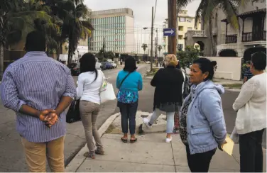  ?? Adalberto Roque / AFP / Getty Images ?? Cubans line up in front of the U.S. Embassy in Havana, after the end of the “wet foot, dry foot” approach.