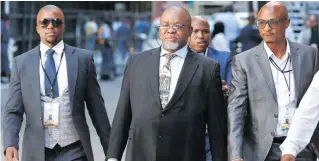  ?? Pictures: EPA-EFE ?? MAIN MAN. Minister of Mineral Resources Gwede Mantashe, centre, arrives ahead of the opening of parliament ceremony yesterday in Cape Town.