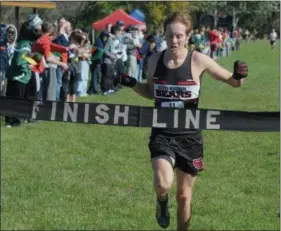  ?? GENE WALSH — DIGITAL FIRST MEDIA ?? Boyertown’s Christian McComb crosses the finish line at the PAC cross country championsh­ip.