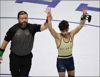  ?? ANDY CROSS — THE DENVER POST ?? Mullen’s Dale O’blia becomes a four-time champion after defeating Jonathan Morrison of Severance in the Class 3A 120-pound final Saturday at Ball Arena.