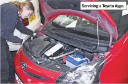  ??  ?? Servicing a Toyota Aygo.