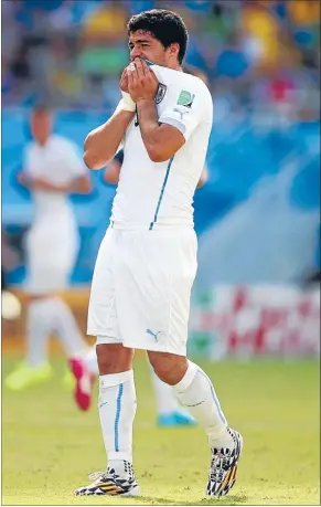  ?? Photo: GETTY ?? Troubled: Luis Suarez ponders his
future after the Chiellini incident during Uruguay’s game against Italy.