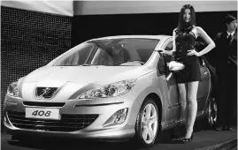  ?? REUTERS ?? File photo of a Peugeot 408 at its global launch in Beijing