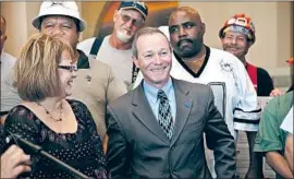  ?? Ted Soqui Corbis via Getty Images ?? ROBBIE HUNTER, center, is a longtime Los Angeles ironworker. He has led the powerful State Building and Constructi­on Trades Council of California since 2012.