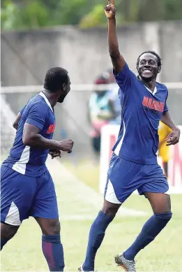  ??  ?? Mount Pleasant Football Academy player Devon Hodges (left) celebrates with goalscorer Kessian Hall after he scored against Albion Mountain in the Eastern Confederat­ion football final at Drax Hall in St Ann on Sunday May 7, 2018.