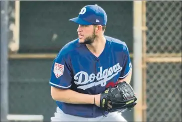  ?? Morry Gash Associated Press ?? DODGERS pitcher Clayton Kershaw said he isn’t convinced that a pitch clock would speed up the game.