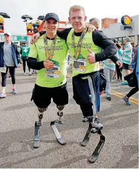  ?? [PHOTO BY BRYAN TERRY, THE OKLAHOMAN] ?? Seth Alexander, left, and Trevor Bunch completed the half marathon at the Oklahoma City Memorial Marathon on Sunday.