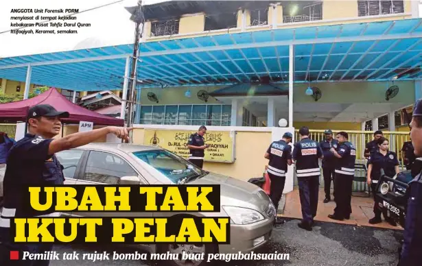  ??  ?? ANGGOTA Unit Forensik PDRM menyiasat di tempat kejadian kebakaran Pusat Tahfiz Darul Quran Ittifaqiya­h, Keramat, semalam.