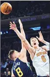  ??  ?? New York Knicks’ Kristaps Porzingis (6) competes for the ball with Utah Jazz’s Jonas Jerebko (left), during the first half of an NBA basketball game at Madison Square Garden in New York on
Nov 15. (AP)