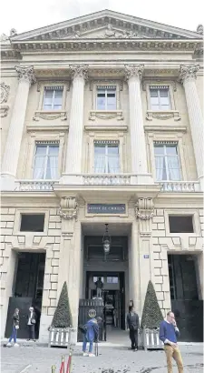  ?? AFP ?? People walk in front of the main entrance of the Hotel de Crillon in Paris.