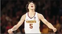  ??  ?? Minnesota’s Amir Coffey (5) celebrates after scoring a 3-pointer against Nebraska late in the second half of an NCAA college basketball gameon Dec 5 in Minneapoli­s. (AP)