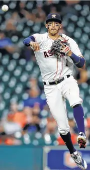  ?? Karen Warren / Houston Chronicle ?? CARLOS CORREA