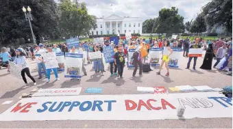  ?? PABLO MARTINEZ MONSIVAIS/ASSOCIATED PRESS ?? Supporters of the DACA program demonstrat­e in front of the White House on Sunday. President Donald Trump is expected today to announce an end in six months to protection­s for childhood immigrants.