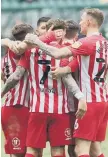  ??  ?? Sunderland players celebrate a goal.