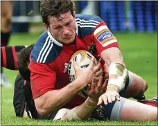  ??  ?? DENIS’S MENACE: Munster centre Denis Hurley crashes over for a try as Munster romp to victory against Edinburgh yesterday