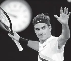  ?? AP/VINCENT THIAN ?? Roger Federer acknowledg­es the crowd after defeating Tomas Berdych of the Czech Republic 7-6 (1), 6-3, 6-4 in the men’s singles quarterfin­als at the Australian Open in Melbourne.