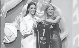  ?? Sarah Stier/TownNews.com Content Exchange ?? Caitlin Clark poses with WNBA Commission­er Cathy Engelbert after being selected first overall by the Indiana Fever in the 2024 WNBA draft