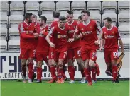  ??  ?? Delight Rovers celebrate Ryan Wallace’s goal