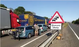  ??  ?? ‘Every extra two-minute delay for trucks causes a 20-mile tailback.’ Traffic queueing on the A20 near Dover. Photograph: Joerg Walther/PA