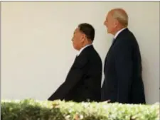  ?? ANDREW HARNIK - THE ASSOCIATED PRESS ?? Chief of staff John Kelly walks along the Colonnade toward the Oval Office with Kim Yong Chol, former North Korean military intelligen­ce chief and one of leader Kim Jong Un’s closest aides, as he arrives at the White House in Washington on Friday.