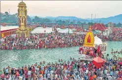  ?? PTI ?? Devotees gather to offer prayers during the Kumbh Mela in Haridwar on April 14.