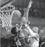  ?? Lynne Sladky Associated Press ?? WENDELL CARTER JR. blocks a shot by Miami’s Bruce Brown Jr. as Duke comes back from 13 down.