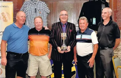  ??  ?? President Lennie Herbert (centre) presents the trophy to the winners of the 12th annual charity golf day organised by the Rotary Club of Church and Oswaldtwis­tle (from left) Andy Kay, Alan Morris, Peter Grogan and Pat Quinn