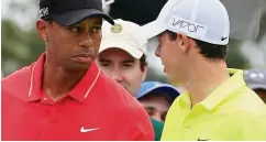  ?? GETTY IMAGES ?? Ready to go: Woods and McIlroy on the first tee