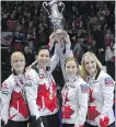  ?? PAUL CHIASSON, THE CANADIAN PRESS ?? Canada’s world champs, from left, Dawn McEwen, Jill Officer, Kaitlyn Lawes and Jennifer Jones hoist the trophy after beating Sweden on Sunday.