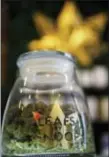  ?? DAVID ZALUBOWSKI — THE ASSOCIATED PRESS FILE ?? Shown is the label on a jar in the marijuana line marketed by rapper Snoop Dogg in one of the LivWell marijuana chain’s outlets south of downtown Denver.