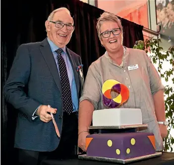  ?? JOHN HAWKINS/ STUFF ?? The first Community Trust of Southland chairman, Bob Simpson, and present chairman Margot Hishon cut the cake marking the 30th anniversar­y of the trust.